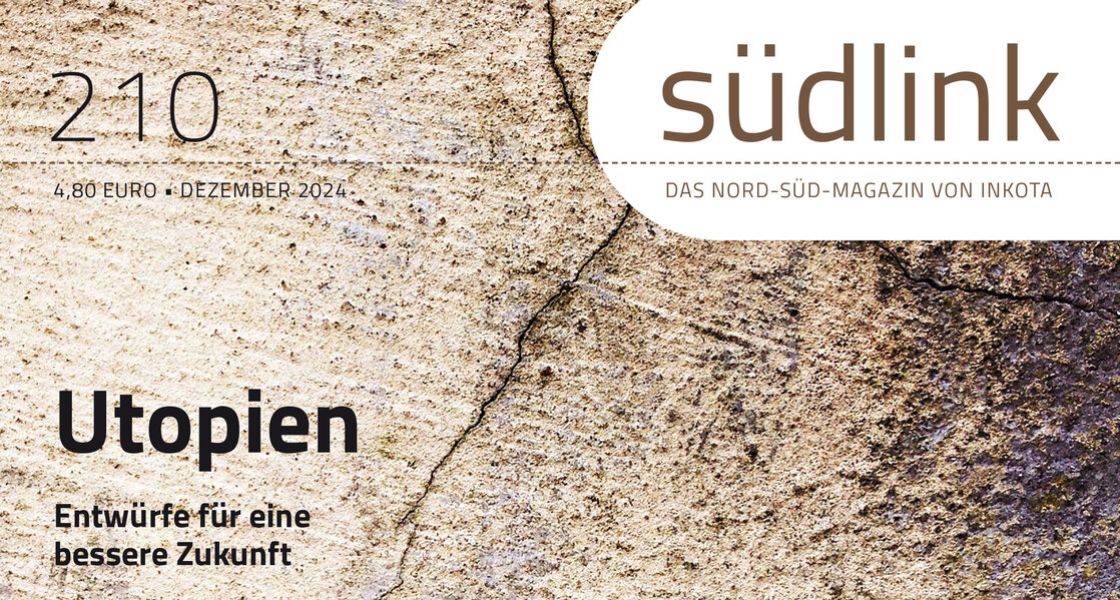eine graue Steinwand, auf der das Wort "Utopia" in roten Buchstaben gedruckt wurde